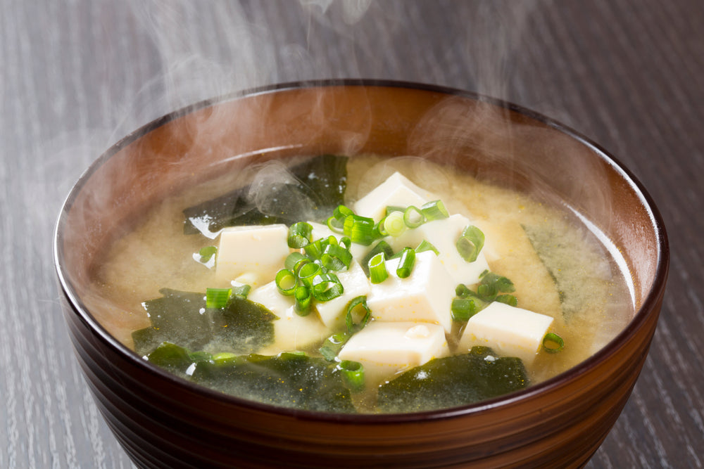 Steaming bowl of white miso soup.