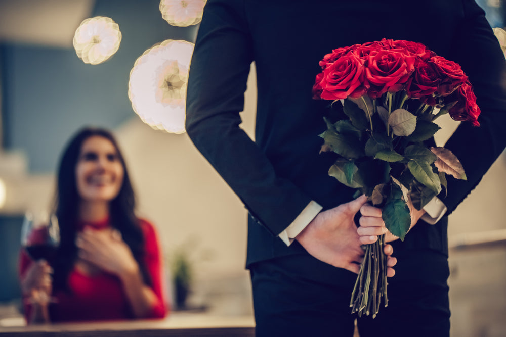 roses valentine's day woman man romance surprise love happy couple wine flowers red dress suit